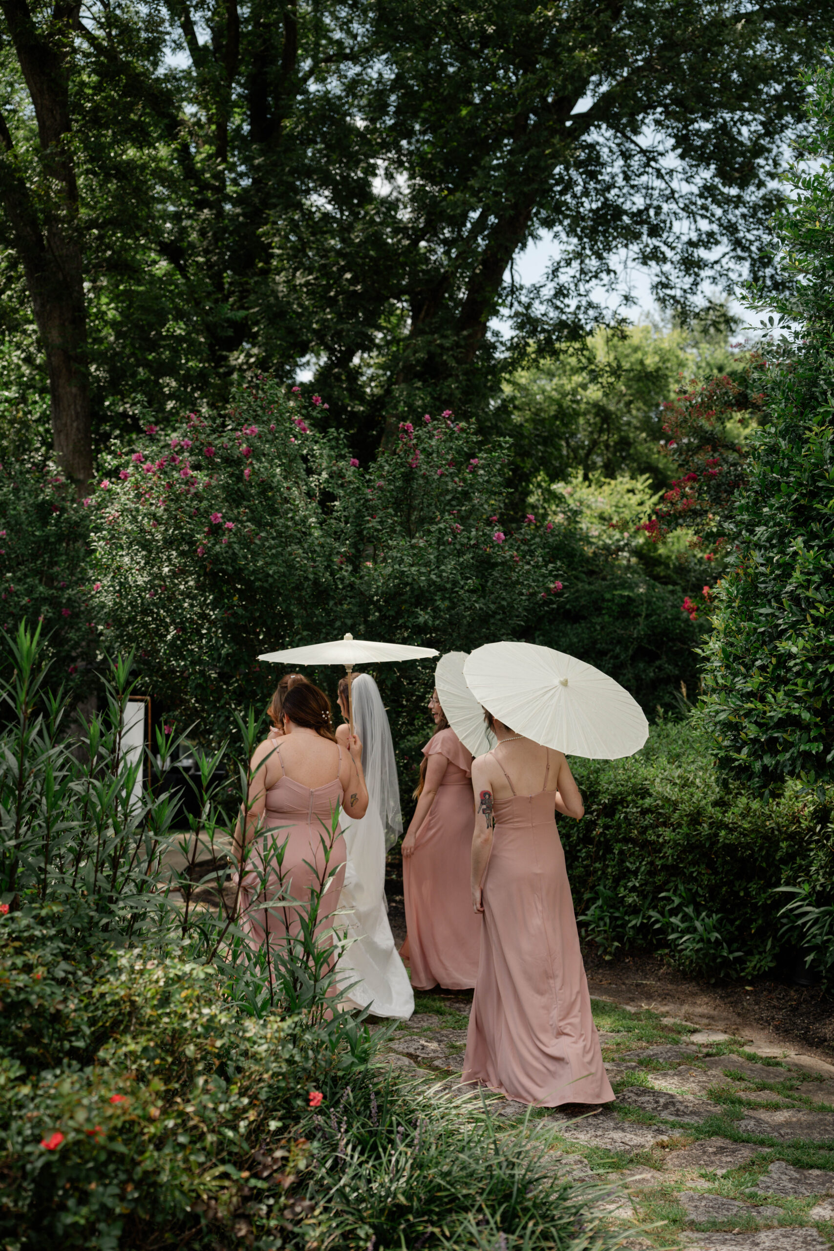 bridal party walks the grounds of the stunning venue
