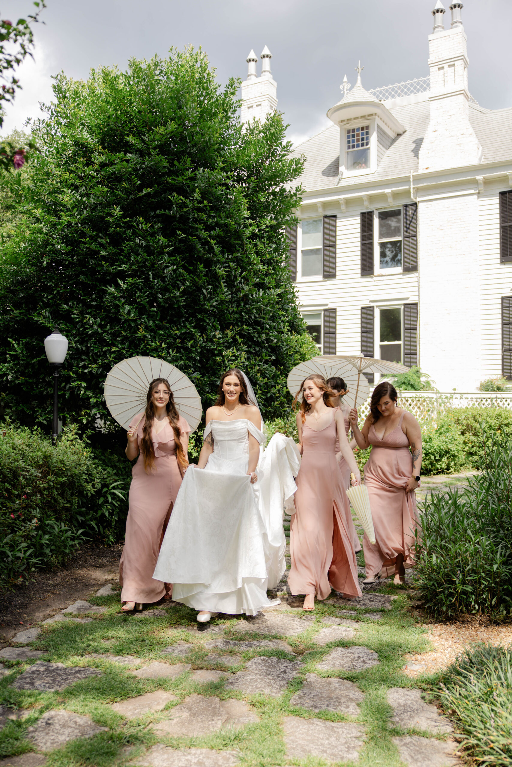 bridal party walks the grounds of the stunning venue