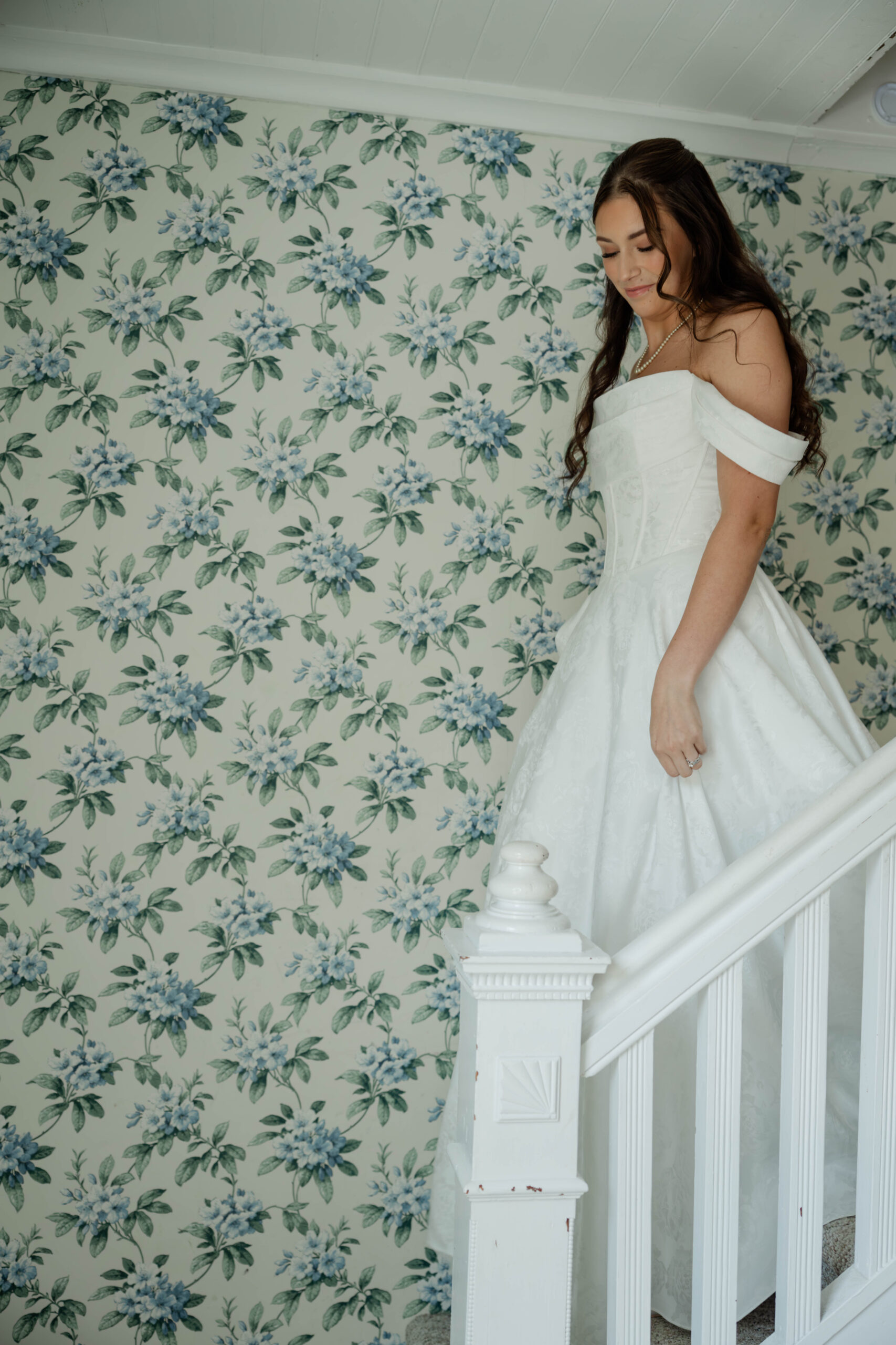 bride walks down the stairs at Wildflower 301 wedding venue